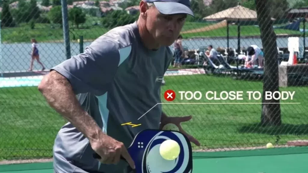Avoid the ball too close to body