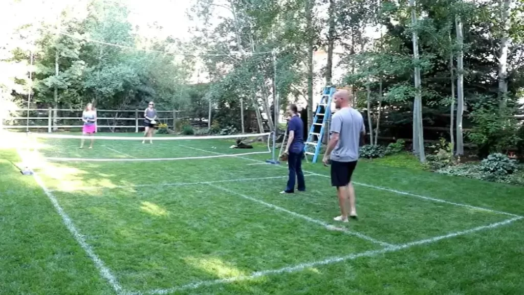Playing Pickleball on grass surface