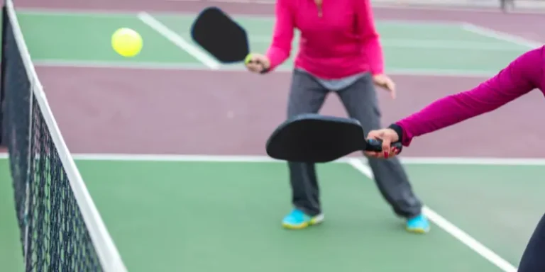 Can your paddle cross the plane of the pickleball net