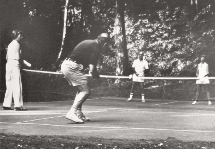 Vintage photo of early Pickleball players on an outdoor court